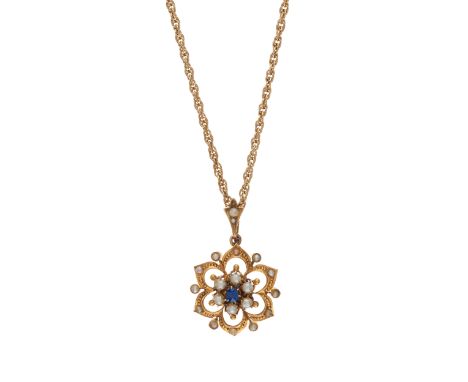 An early 20th century 9ct gold sapphire and split pearl floral openwork pendant, suspended from a later 9ct gold fancy-link c