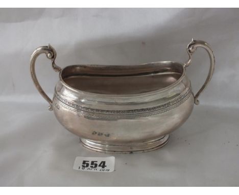 Heavy boat shaped sugar bowl, 6" over flying scroll  handles Lon 1913 by Goldsmiths Co. 260g.    