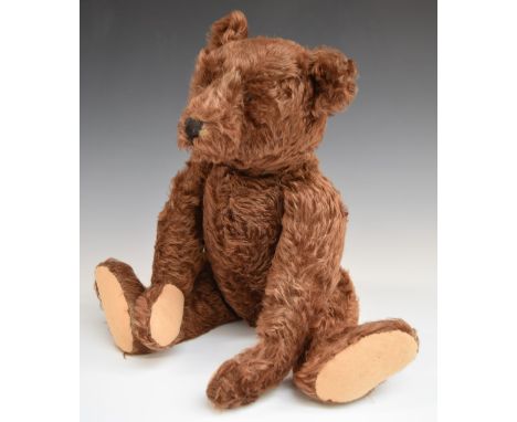 Steiff Teddy bear with growler, cinnamon mohair, straw filling, disc joints, stitched features and button to ear, 50cm tall.&