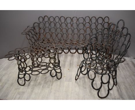 Garden furniture suite made from horseshoes comprising sofa, chair and table