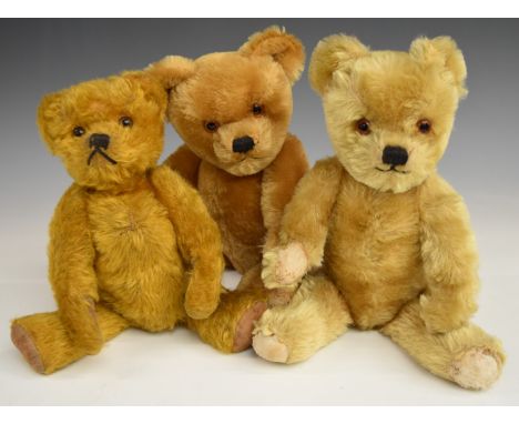 Three Chad Valley or similar Teddy bears each with growler, golden mohair, disc joints, straw or soft filling and cloth pads,