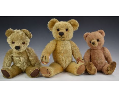 Three Chad Valley, Merrythought or similar Teddy bears one with pink mohair, shaved snout, disc joints, straw filling and clo