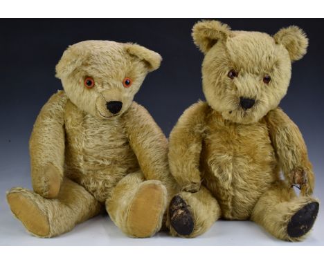 Two Chad Valley, Merrythought or similar Teddy bears one with golden mohair, leather pads, disc joints, soft filling and stit