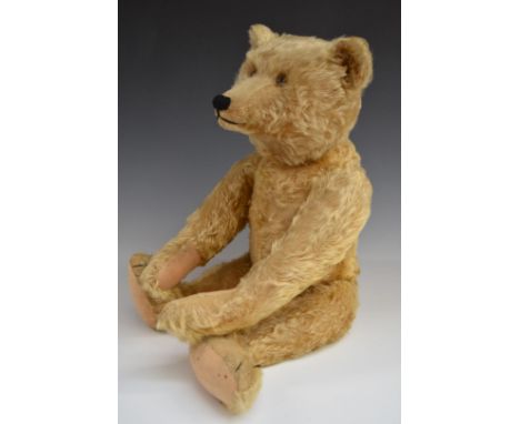 Steiff Teddy bear with blonde mohair, straw filling, disc joints, stitched features and button to ear, 60cm tall.&nbsp;