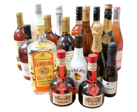 A collection of various wines and spirits, including Gordons Dry Gin, Moet &amp; Chandon Champagne, Grand Marnier x 2, bottle