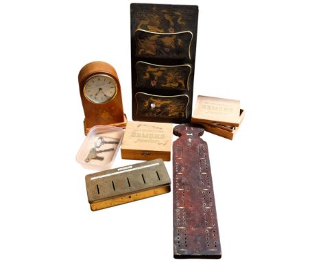 A Knight Gibbins battery operated clock, a lacquered stationery rack with dragon design, a cribbage board, etc