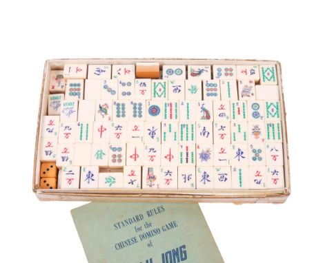 A bamboo and engraved and painted plastic Mahjong set with rules