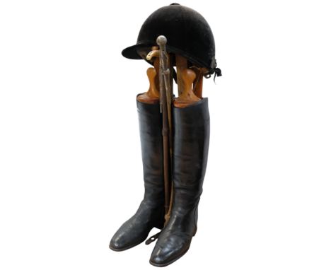 Vintage gent's black leather riding boots with wooden boot trees, hat, horn-handled riding crop, and another