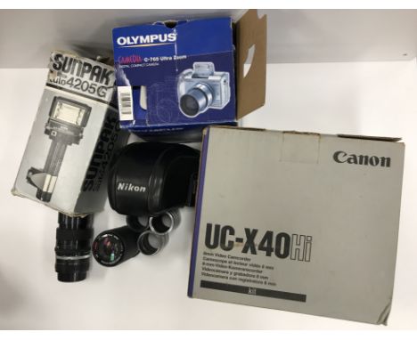 A box of assorted cameras and camera equipment to include an Olympus Camedia C-765 Ultra Zoom, a Canon UC-X40HI 8mm video cam