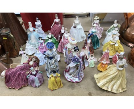 A collection of twenty-nine various figurines to include ten Royal Doulton examples including "Paisley Shawl", "Kate", "Fair 