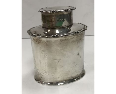 A George V silver oval tea caddy (by Aitken Brothers, Sheffield 1914) 11 cm high, 224 g/7.2 oz