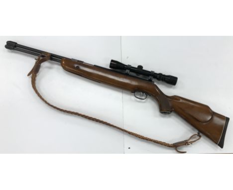 A Weirauch HW77 .22 air rifle with 3-9 x 32 telescopic sight and Dauntsey Guns green / black canvas sleeve CONDITION REPORTS 
