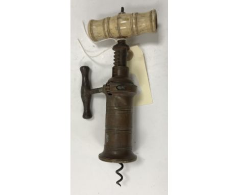 A 19th Century brass cylinder Thomason type double action corkscrew with turned bone handle (brush missing) and steel side ha