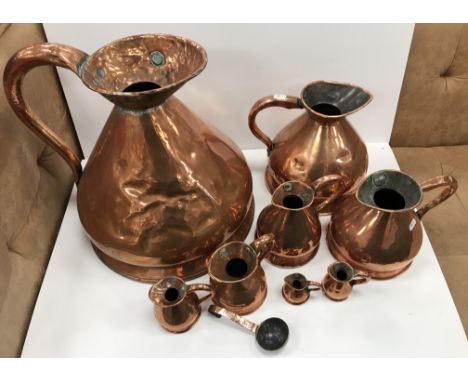 A collection of eight Victorian copper haystack measures comprising 4 gallon, 1 gallon, half gallon, quart, pint, half pint, 