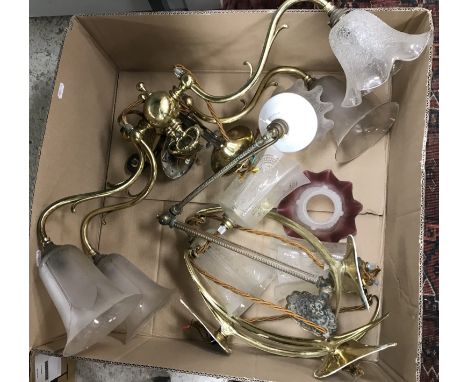 A set of three brass wall lights in the Art Nouveau taste, together with a pair of brass hanging twin branch rise and fall la