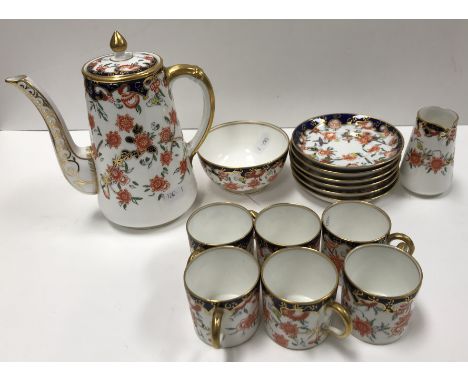 A Royal Crown Derby Japan pattern coffee service with all over flower head decoration (pattern No. 4259) date marked for 1926