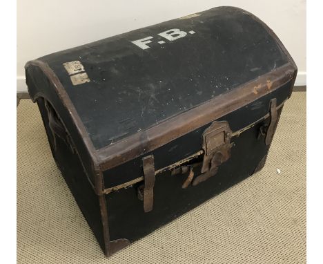 A stained pine trunk of small proportions, 59 cm wide x 37 cm deep x 31 cm high and a Victorian leather bound stained canvas 