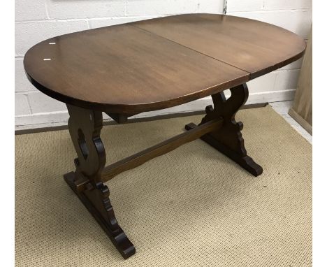 A modern oak D end dining table on end trestle supports, 127 cm long x 81.5 cm wide x 75 cm high, a set of eight modern beech