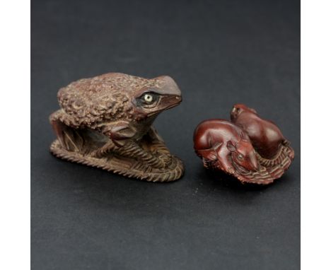 A carved hardwood netsuke of a frog, L. together with a carved hardwood netsuke of two rats.