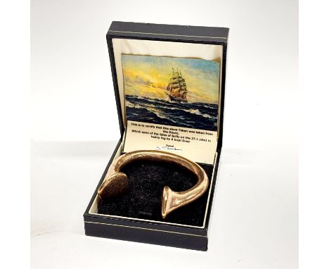 A 19th C copper slave bangle with certificate stating found of the Isles Scilly from a ship sunk in 1843.
