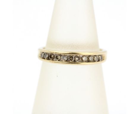 A 9ct yellow gold diamond set half eternity ring, (K.5).