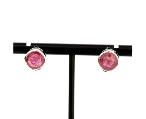 A pair of 9ct white gold ruby set earrings, dia. 1.1cm.