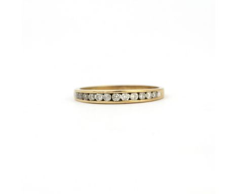 A 9ct white gold diamond set half eternity ring, (N).