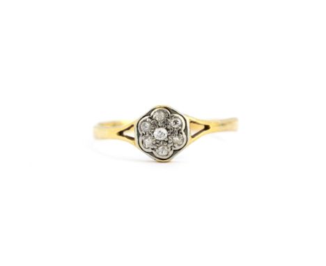 An early 20th century 18ct yellow and white gold diamond set clusetr ring, N.5.