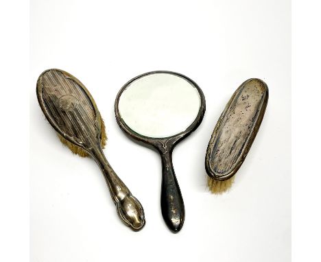 A hallmarked silver back dressing table set.