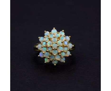 A large 9ct yellow gold opal set cluster ring, N.5.