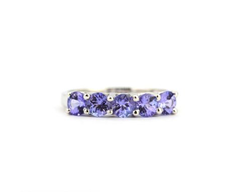 A 9ct white gold half eternity ring set with tanzanites, N.