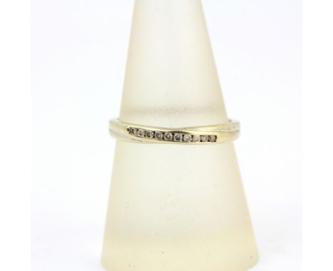 A 9ct white gold diamond set half eternity ring, (P).