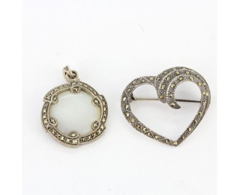 A 925 silver marcasite and mother of peal set pendant, L. 3.2cm. Together with a silver marcasite brooch.