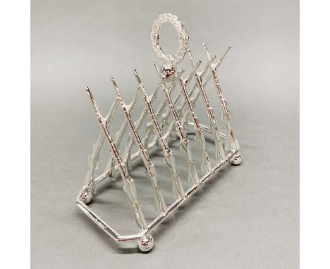 A silver plated rifle toast rack, L. 19cm.