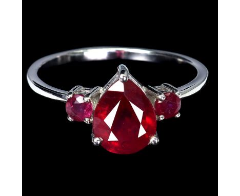 A 925 silver ring set with pear and round cut rubies, ring size O.