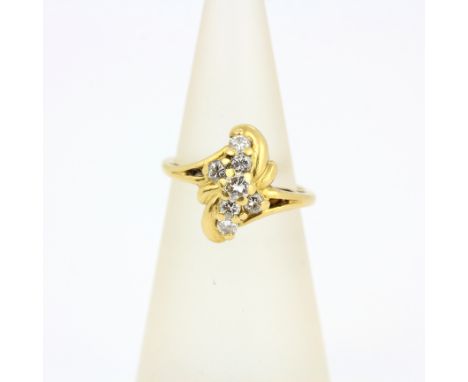 An 18ct yellow gold crosso ver ring set with brilliant cut diamonds, approx. 0.20ct, (G).