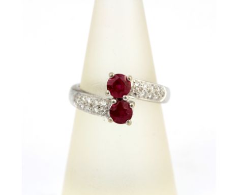 An 18ct white gold ring set with rubies and diamonds, (M.5).
