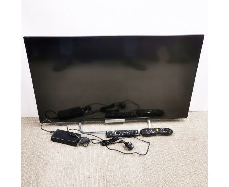 A 42 inch Sony LCD TV model no. KDL-42W653A with remote.