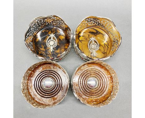 Two pairs of silver plated wine bottle coasters, dia. 12cm.
