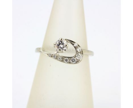 An 18ct white gold ring set with brilliant cut diamonds, (M).