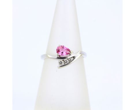 A 9ct white gold ring set with a pear cut pink sapphire and brilliant cut diamonds, (L).