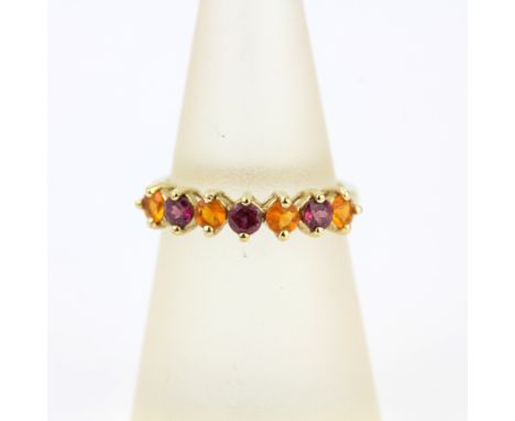 A 9ct yellow gold half eternity ring set with fire opals and tourmalines, L.5.
