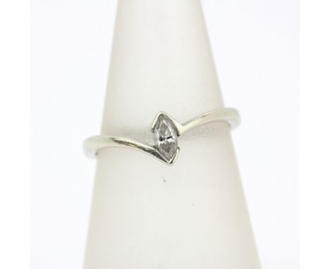 A 9ct white gold ring set with a marquise cut solitaire ring, (L).