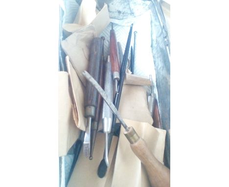 Tin and contents, some leather tanning tools
