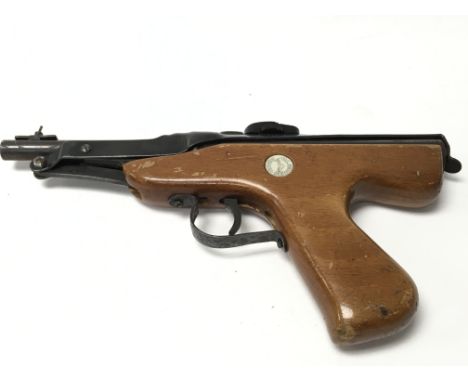 A vintage wooden handled Diana .177 Mark IV air pistol.