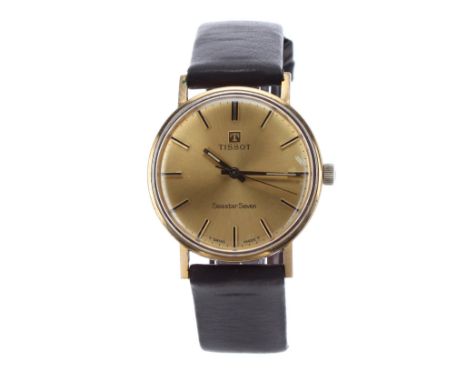 Tissot Seamaster Seven 9ct gentleman's wristwatch, circular champagne dial with baton markers, and centre seconds, modern bla