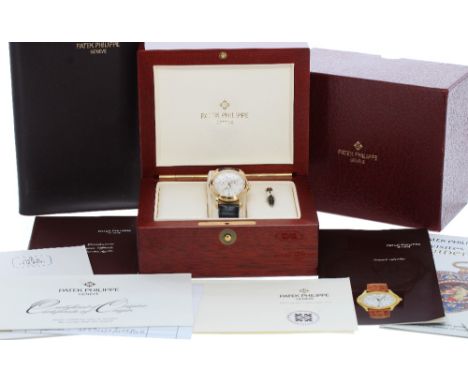 Fine Patek Philippe Annual Calendar 18ct automatic gentleman's wristwatch, ref. 5035J-001, circular silvered dial with gilt R