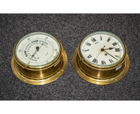 A Brass Porthole Clock with Roman numerals, painted dial together with matching aneroid barometer.