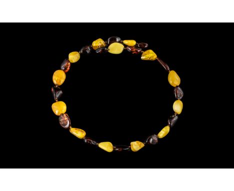 Vintage Amber Necklace, egg yolk and butterscotch and dark cherry beads, each separated by a small bead.  Rotates on a spring