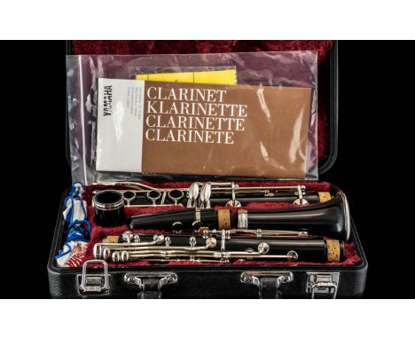 Yamaha Clarinet In Black Fitted Case, with a Red Plush Lining. Comes with Yamaha Owners Manual and Yamaha Polishing Cloth. Ha